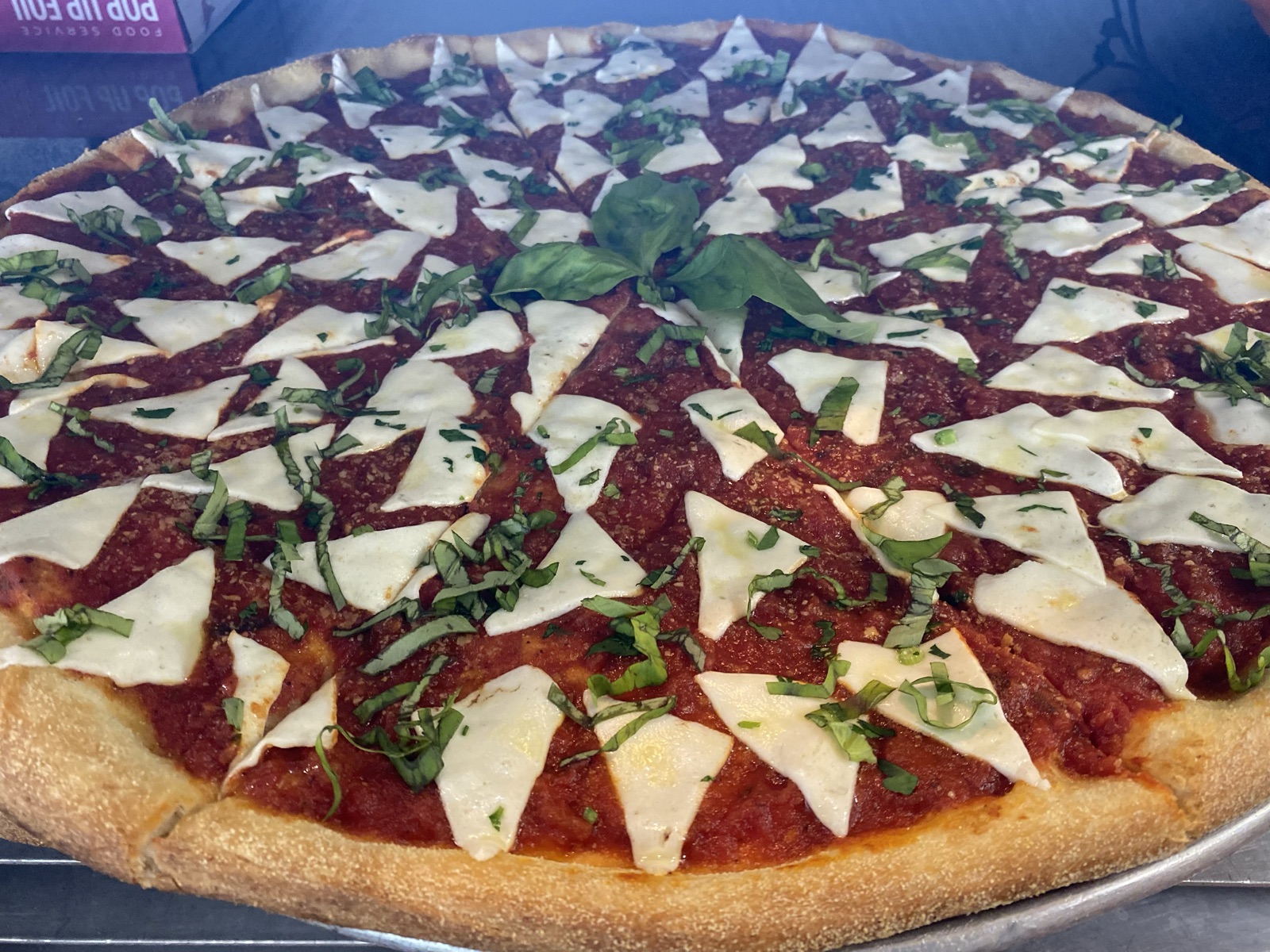Margherita pizza with fresh mozzarella, basil, and San Marzano tomato sauce